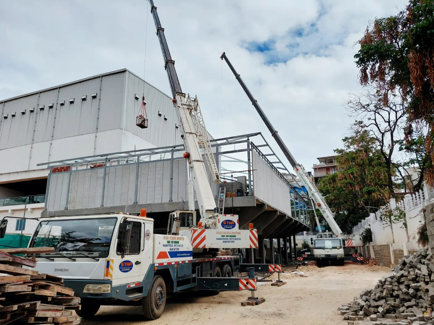 Cranes outside an industrial building