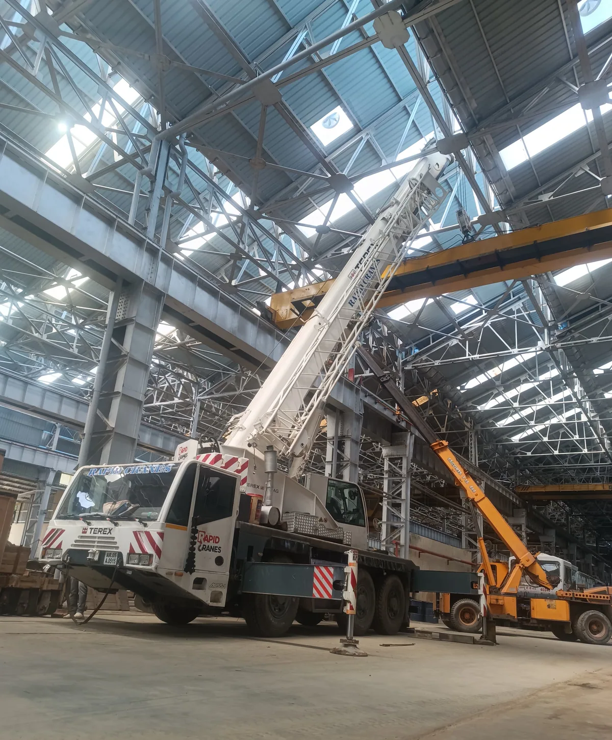 Mobile crane inside an industrial workspace