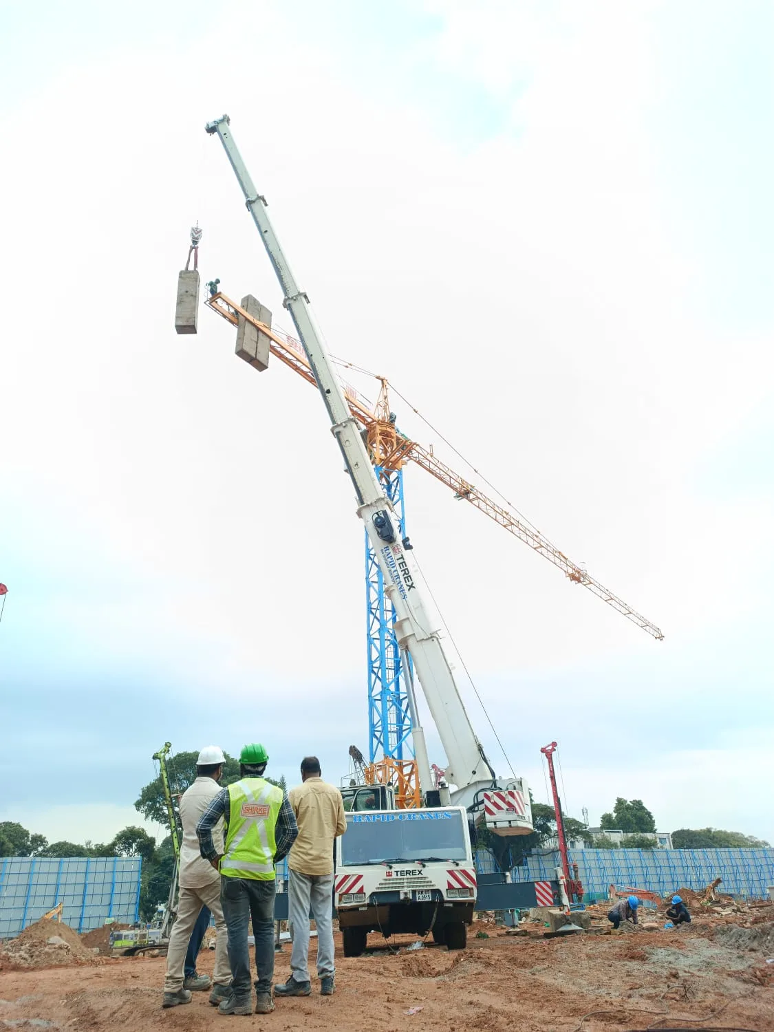 Crane and crew at a work site