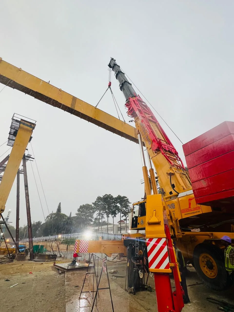 Crane lifting a steel beam